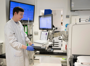 Loading samples into a machine in a blood sciences lab