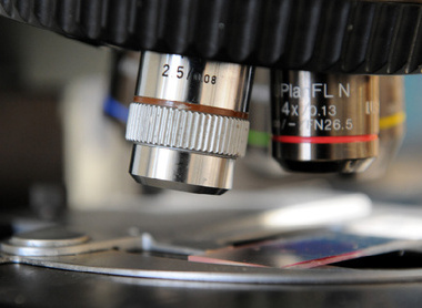 Close-up image of a microscope and a slide