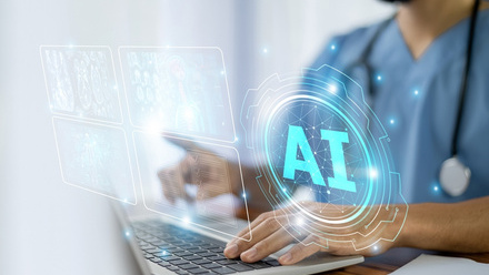 Doctor using a laptop to access AI.