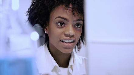 Researcher looking at a computer in a laboratory