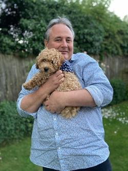 Professor Mike Osborn holding his dog Scout