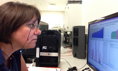 Kay Poulton looking at a computer screen