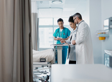 Team of doctors at patient's bed.jpg