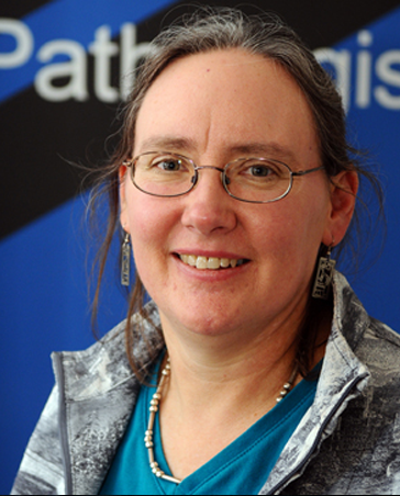 Dr Kimberly Gilmour smiling at the camera