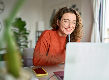 Smiling person at laptop