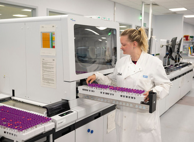 Putting samples in a machine in a haematology lab