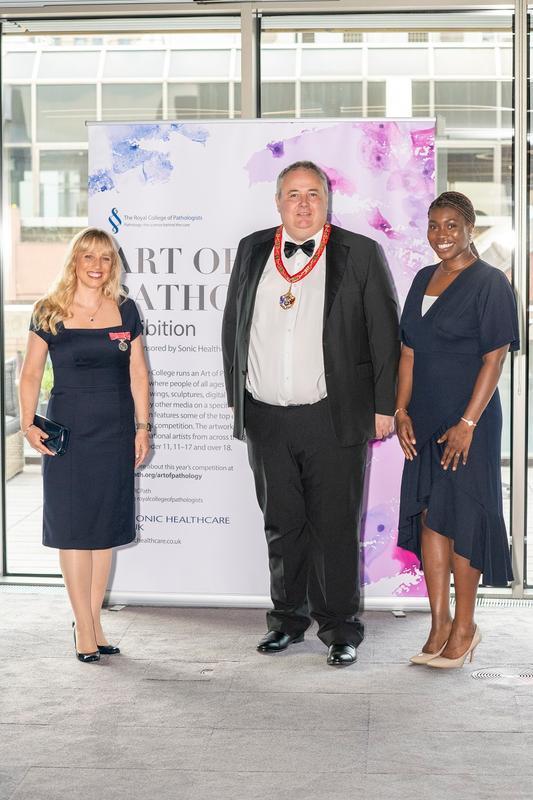 Professor Mike Osborn,  Dr Lisa Levett and Michelle Joseph at a 2023 art exhibition displaying entries from the 2022 Art of Pathology competition