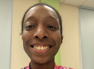 Dr Chibuzo Mowete smiling at the camera