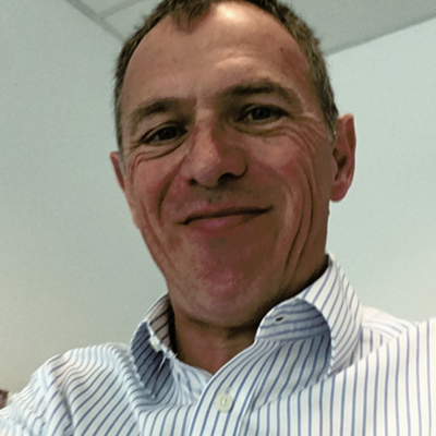 Dr Philip Rice smiling at the camera