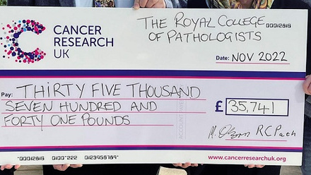 Cheque for CRUK from the Lands End to John O'Groats RCPath fundraising