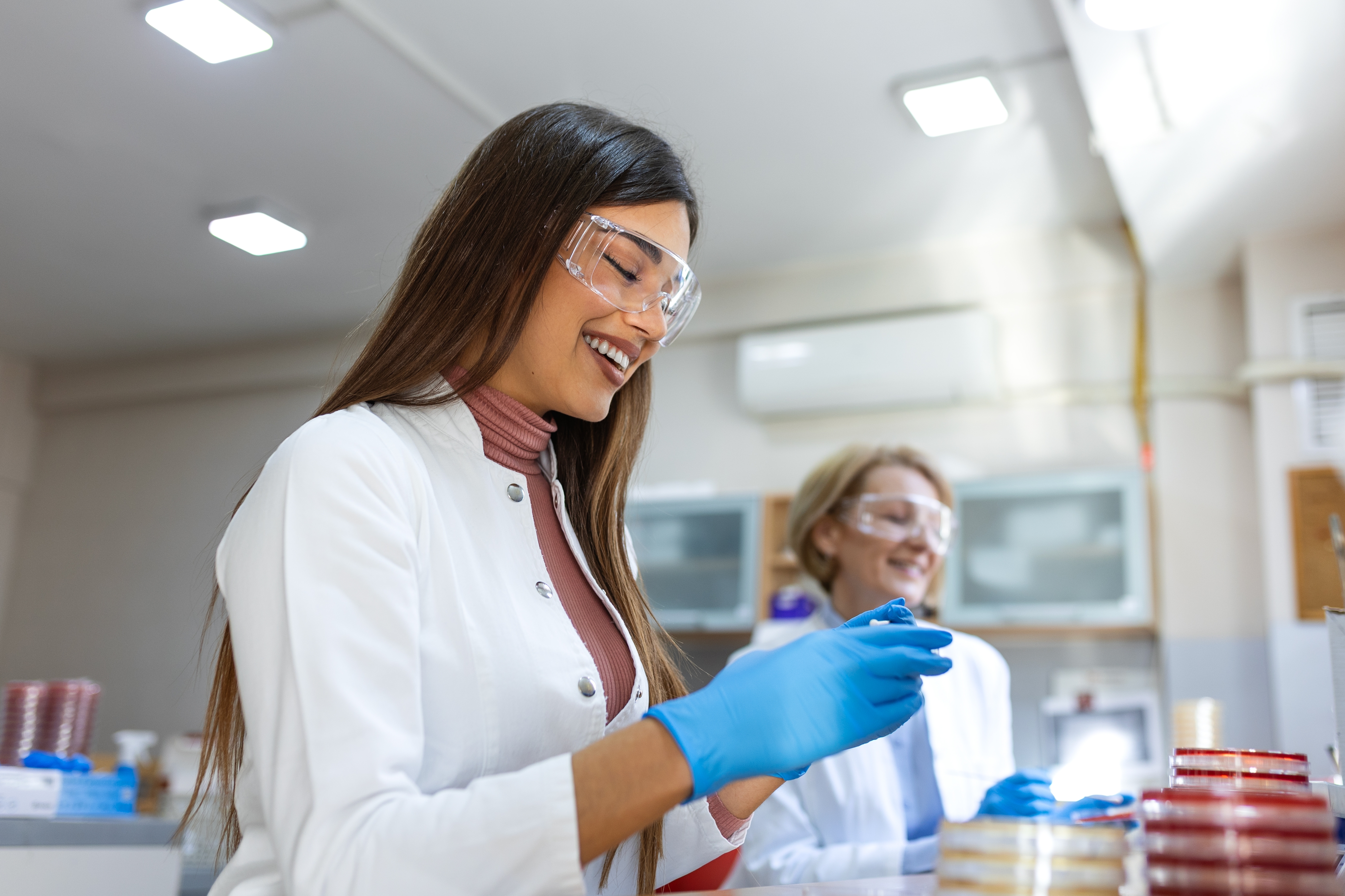 Two scientists working in a microbiology laboratory