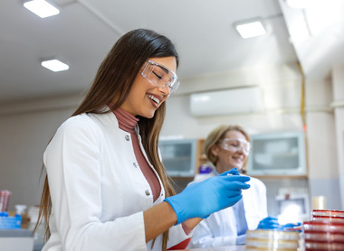 Two scientists working in a microbiology laboratory