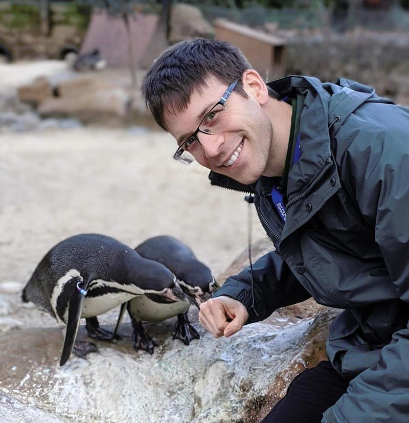 Simon Spiro with penguins