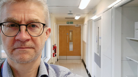 Dr Chris Tiplady in a hospital corridor