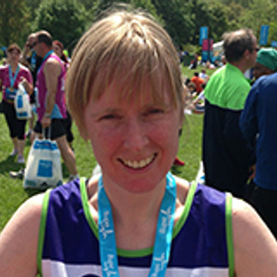 Image of Dr Rachel Brown outside with a medal around their neck