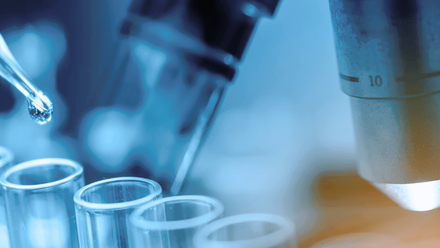 Test vials in front of microscope_higher res copy.png