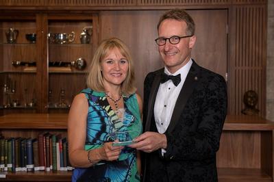 Dr Sue Pavord and Dr Will Lester collecting the RCPath Achievement Award ion behalf of the VITT  team in 2022