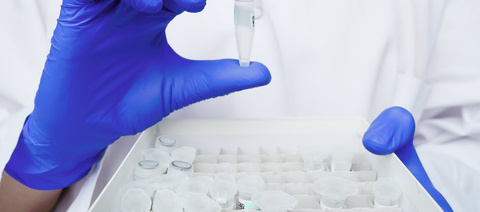 Scientist holding DNA sample.jpg