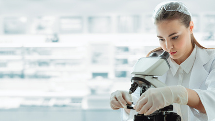 medical_scientist_researcher_using_microscope_laboratory.jpg