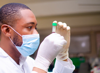 Person looking at a sample in a lab