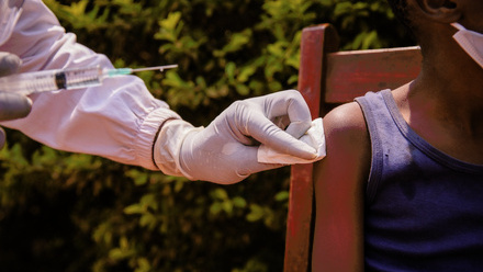 doctors-hands-holding-syringe-vaccinating.jpg