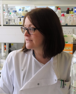 Dr Philippa May in a laboratory
