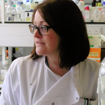 Dr Philippa May in a laboratory