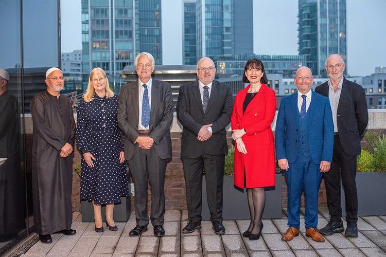 Attendees of a medical examiner event on the roof terrace