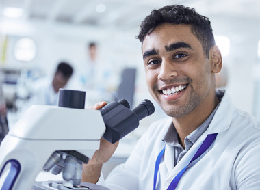 Scientist in lab smiling