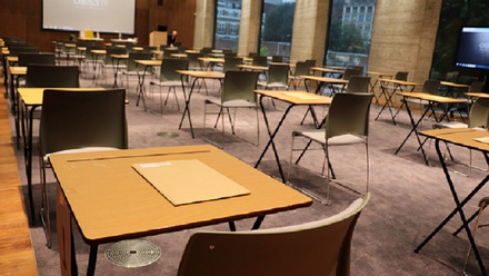 Exam set up with tables, chairs and papers