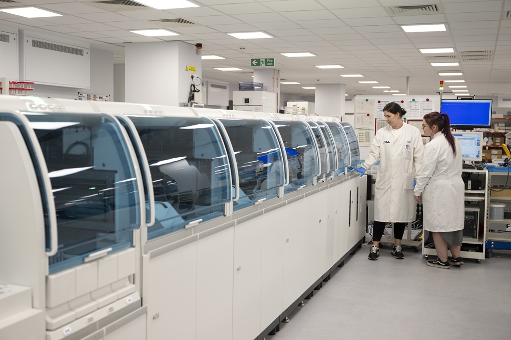 Two people working in a clinical chemistry laboratory