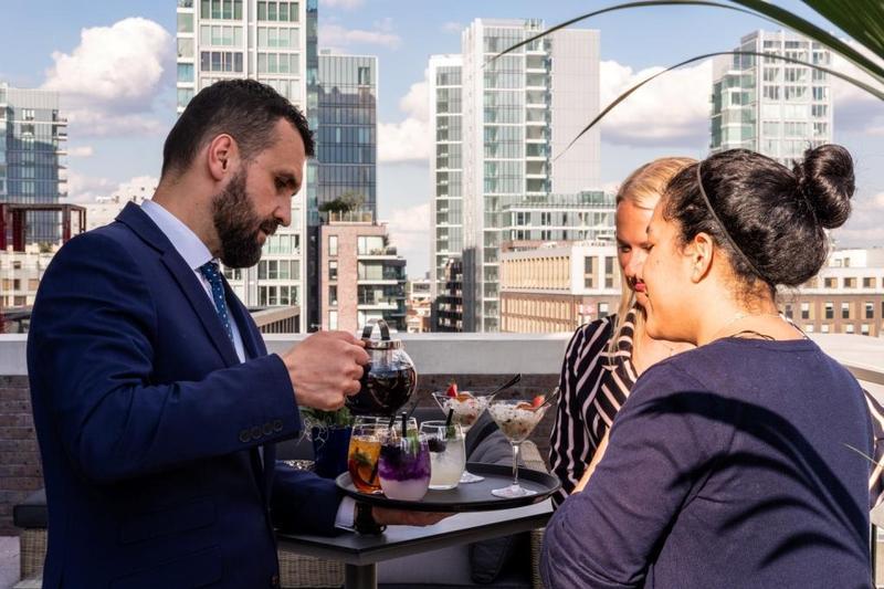 Waiting staff pouring drinks on the Terrace