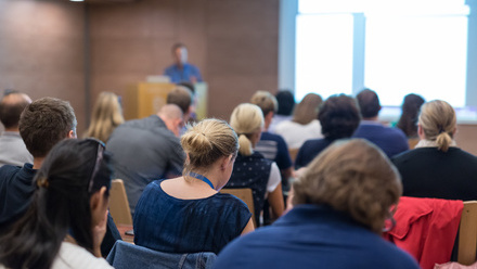 Training conference with speaker at the front