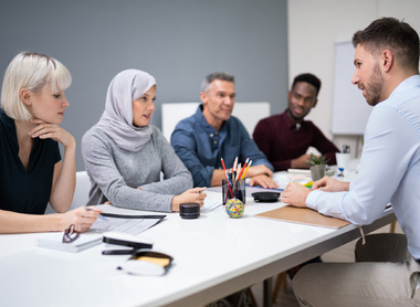Interview panel of four interviewing